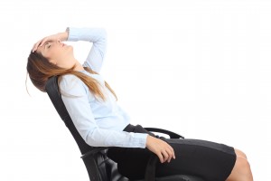 Stress Symptoms Checklist - Profile of a tired businesswoman sitting on a chair isolated on a white background