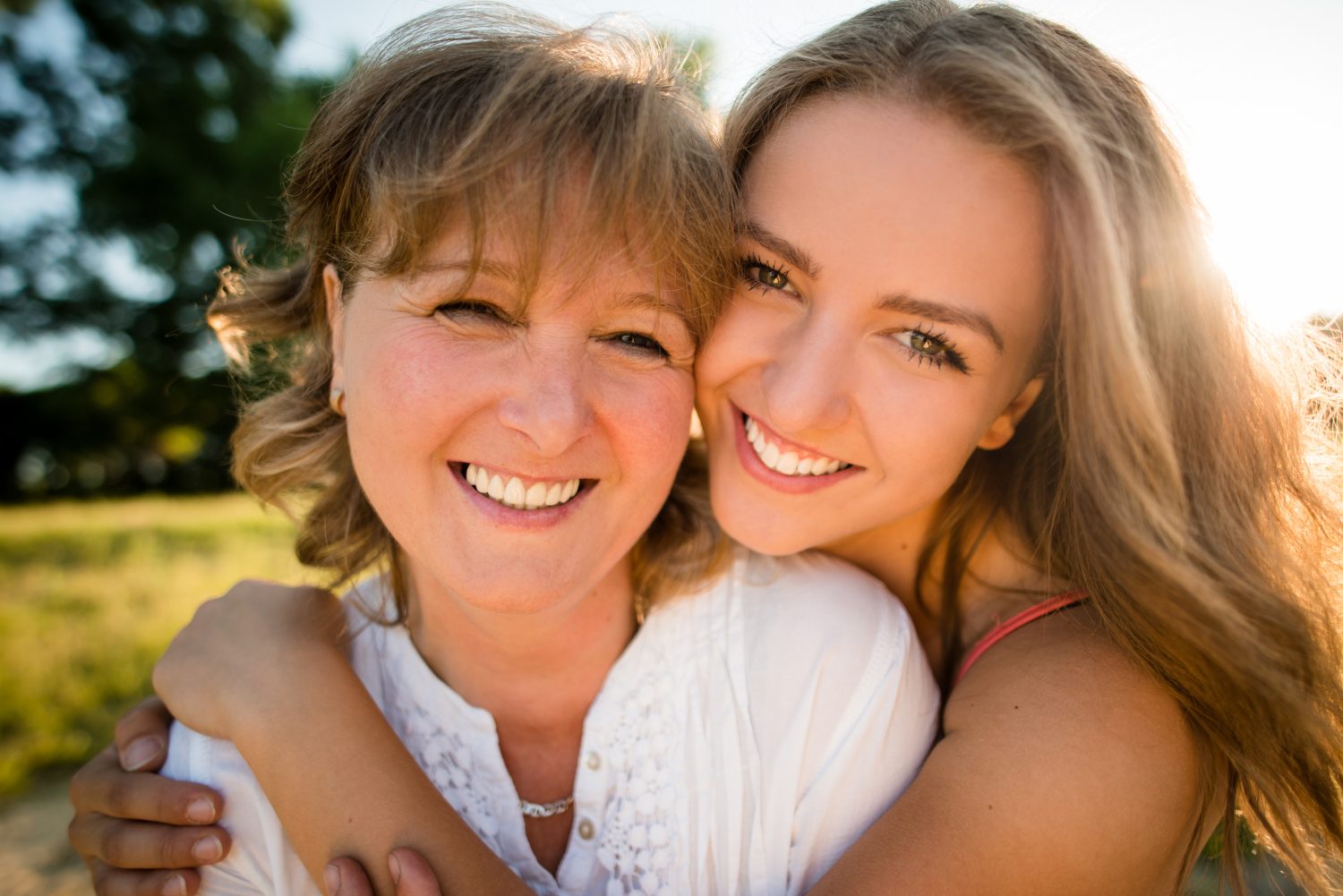 How to Influence Others Positively - Mother and teenage daughter outdoor portrait